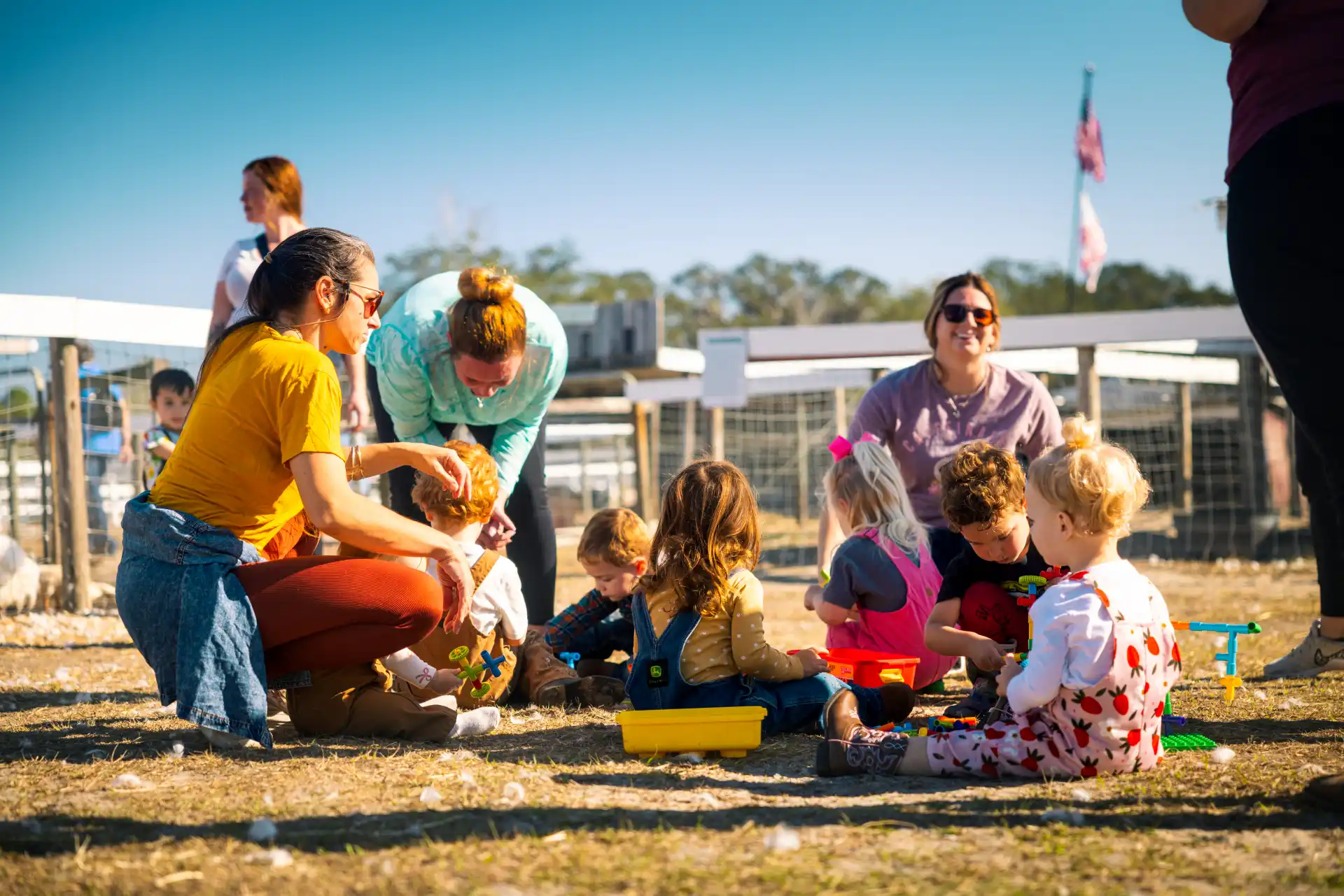 Toddlers ages 1-3 discovering farm animals during Toddler Time at Kiddy Up Ranch